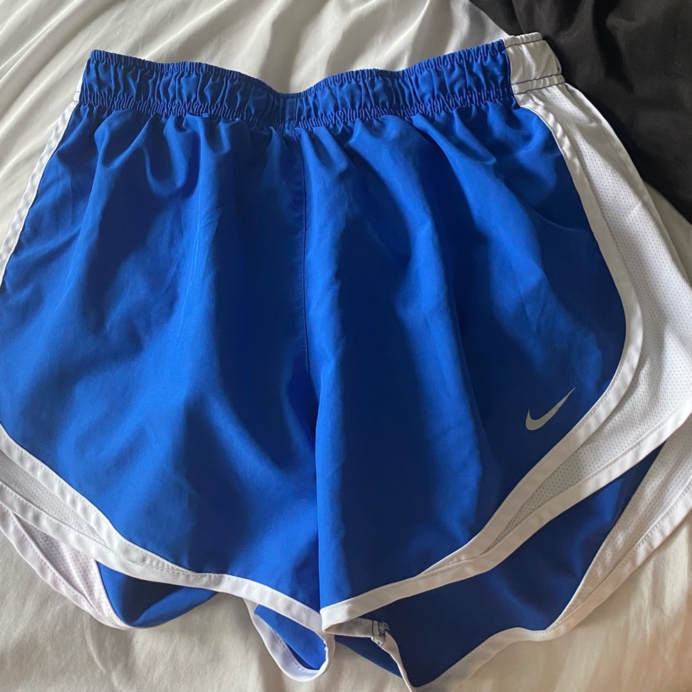 blue and white nike athletic shorts.